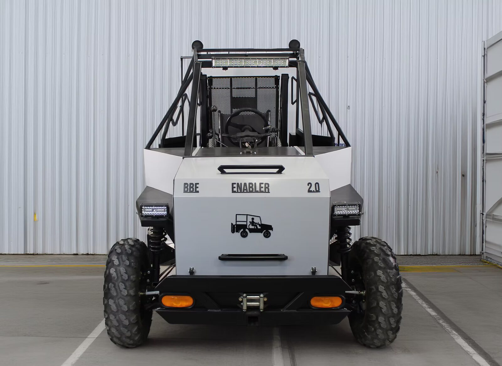 All-electric wheelchair accessible off-road utility vehicle on open ground