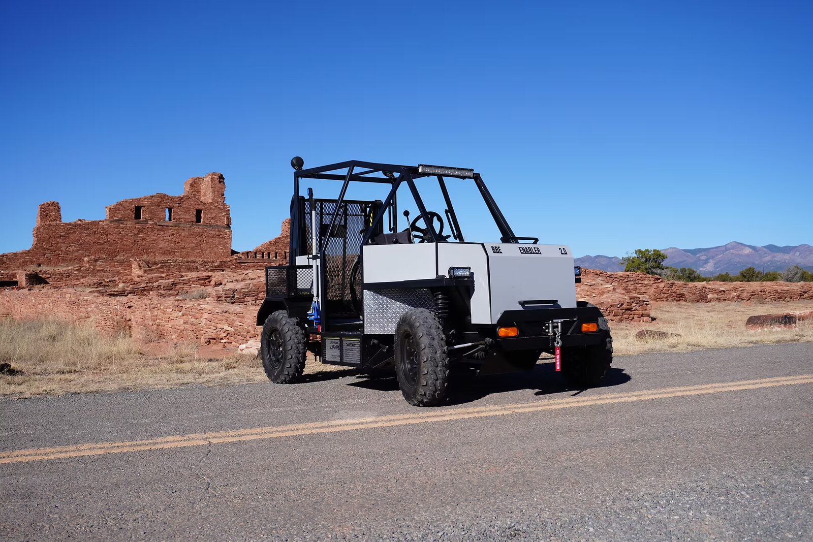 Enabler 2.0 outdoors on rough ground, off-road tires ready for the trail