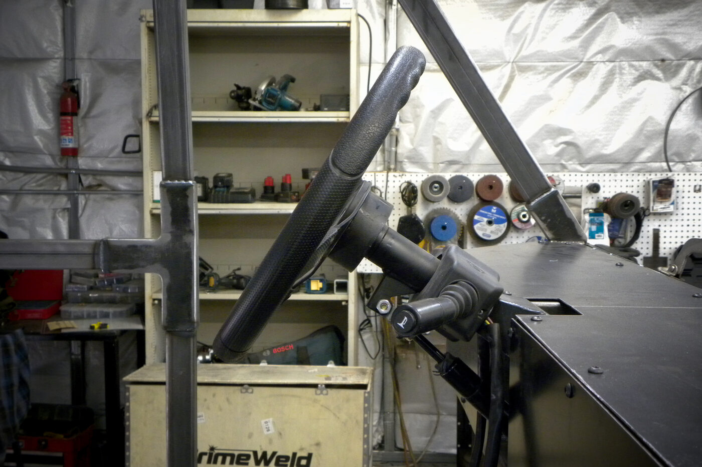 Close-up of the Enabler's steering wheel with an integrated hand-control joystick